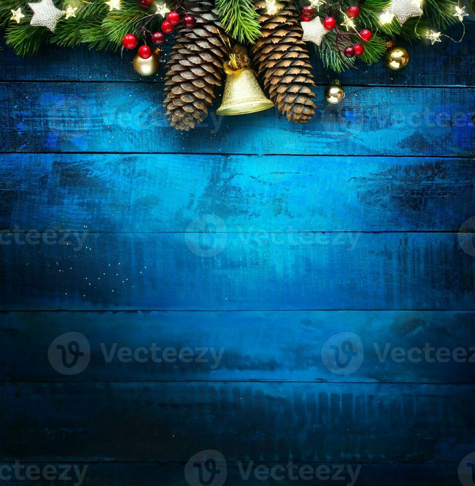 Christmas tree ornament on blue wooden background. Xmas banner design with copy space photo