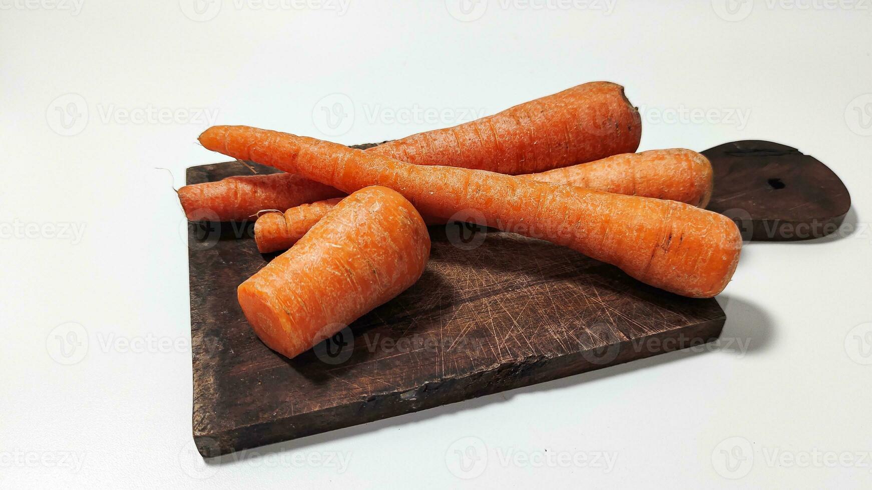 Carrots on a plate for cooking are healthy and carrots contain vitamin A photo