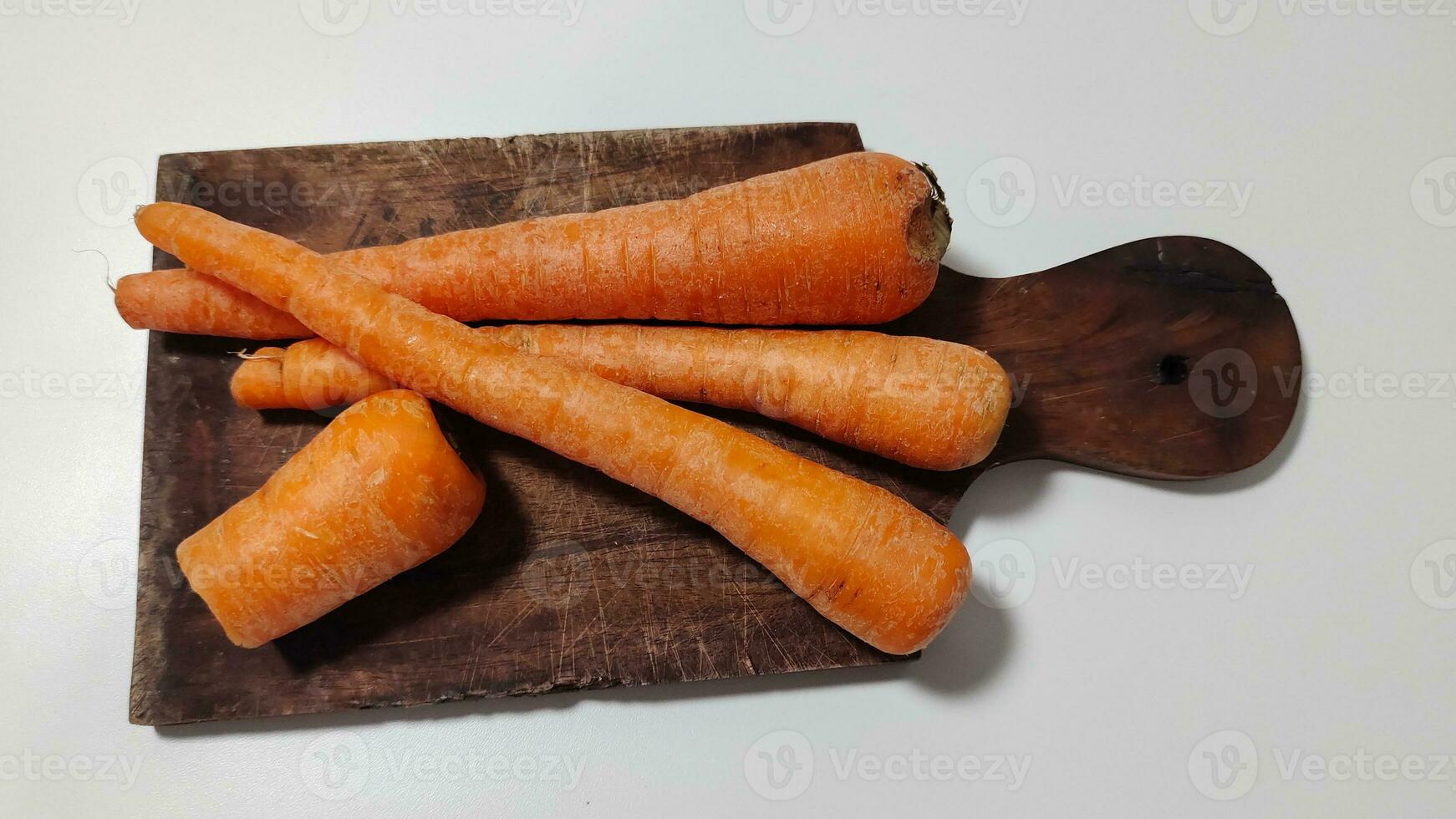 Carrots on a plate for cooking are healthy and carrots contain vitamin A photo