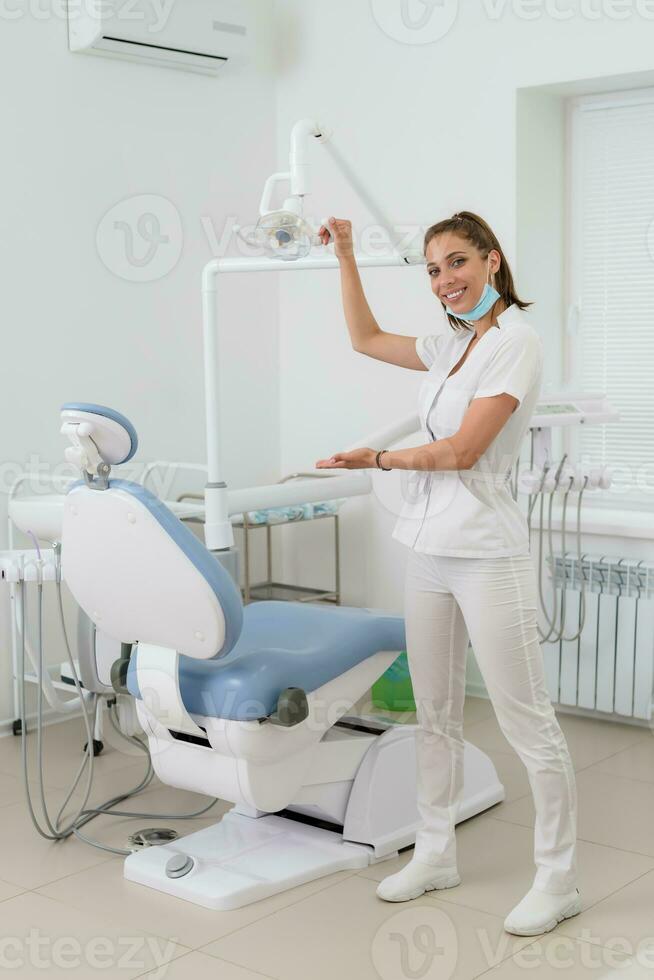 beautiful dentist girl meets her patient in the office photo