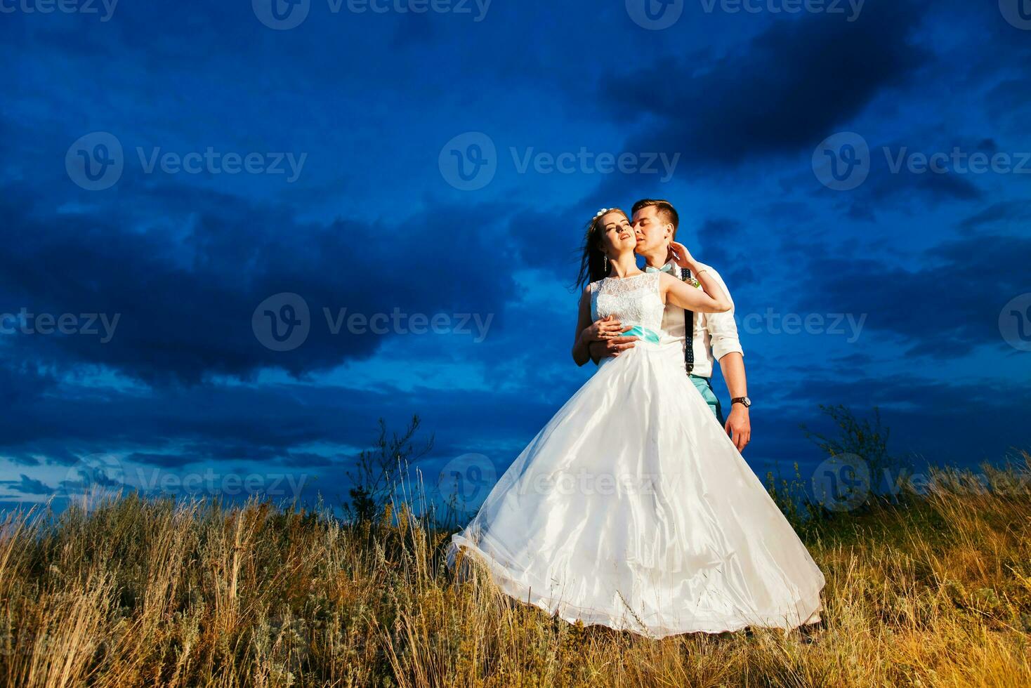 the bride and groom are photographed on the nature photo