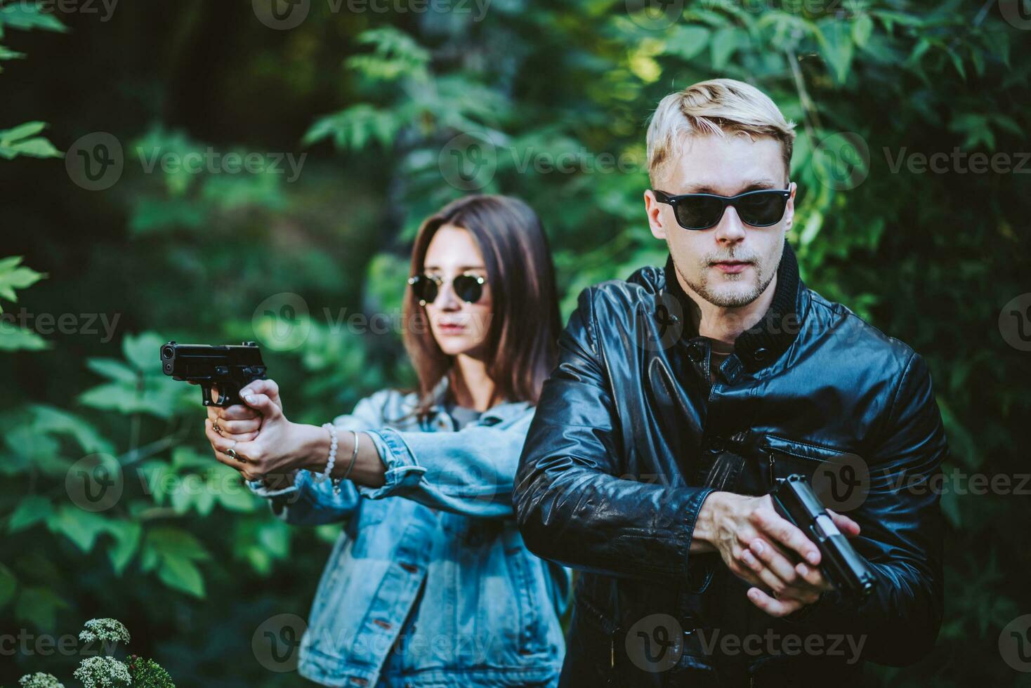 special agents armed with guns in the image of Mr. and Mrs. Smith photo