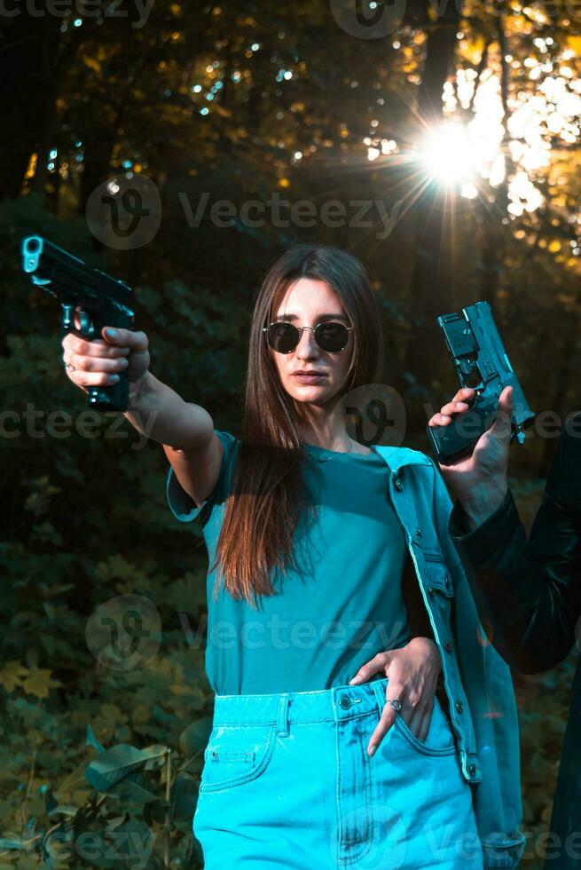 special agents armed with guns in the image of Mr. and Mrs. Smith photo