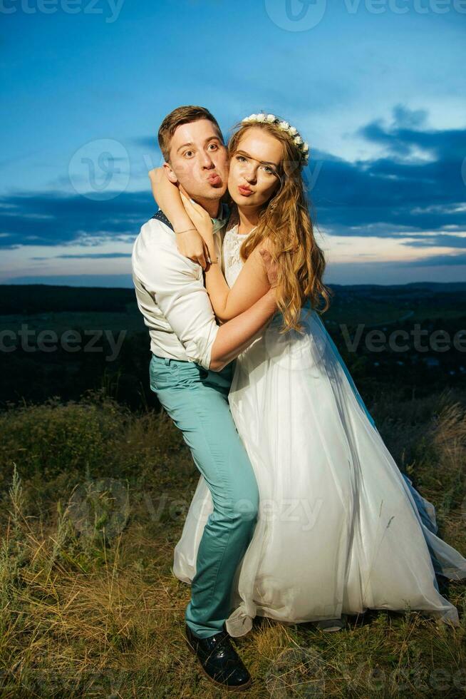 the bride and groom are photographed on the nature photo