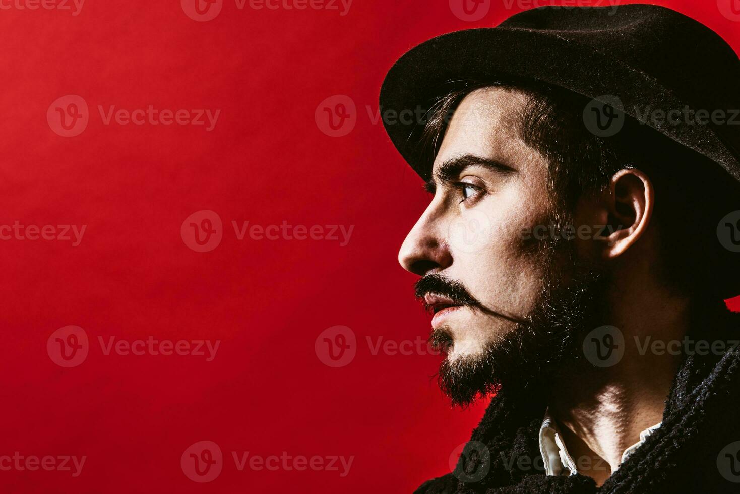 portrait of a guy who is posing in the studio photo