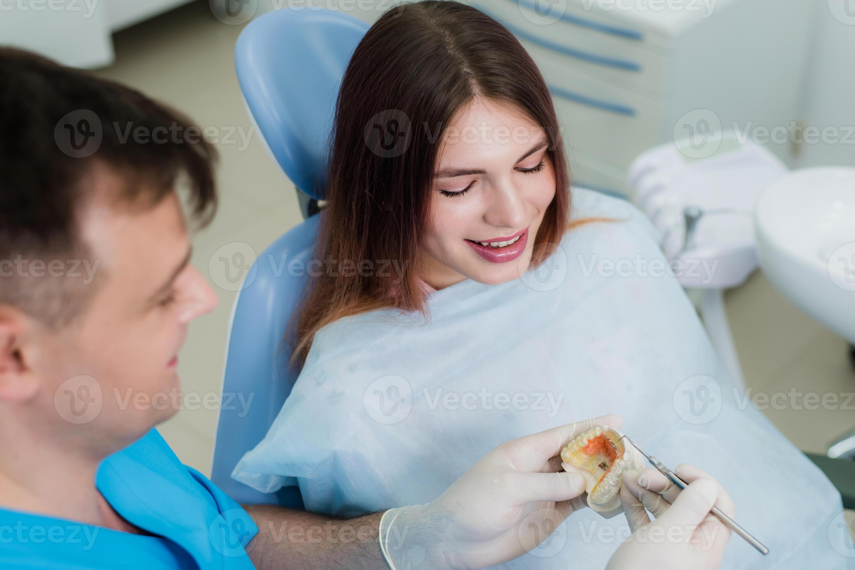 doctor orthodontist showed how the plate works to flatten teeth on the