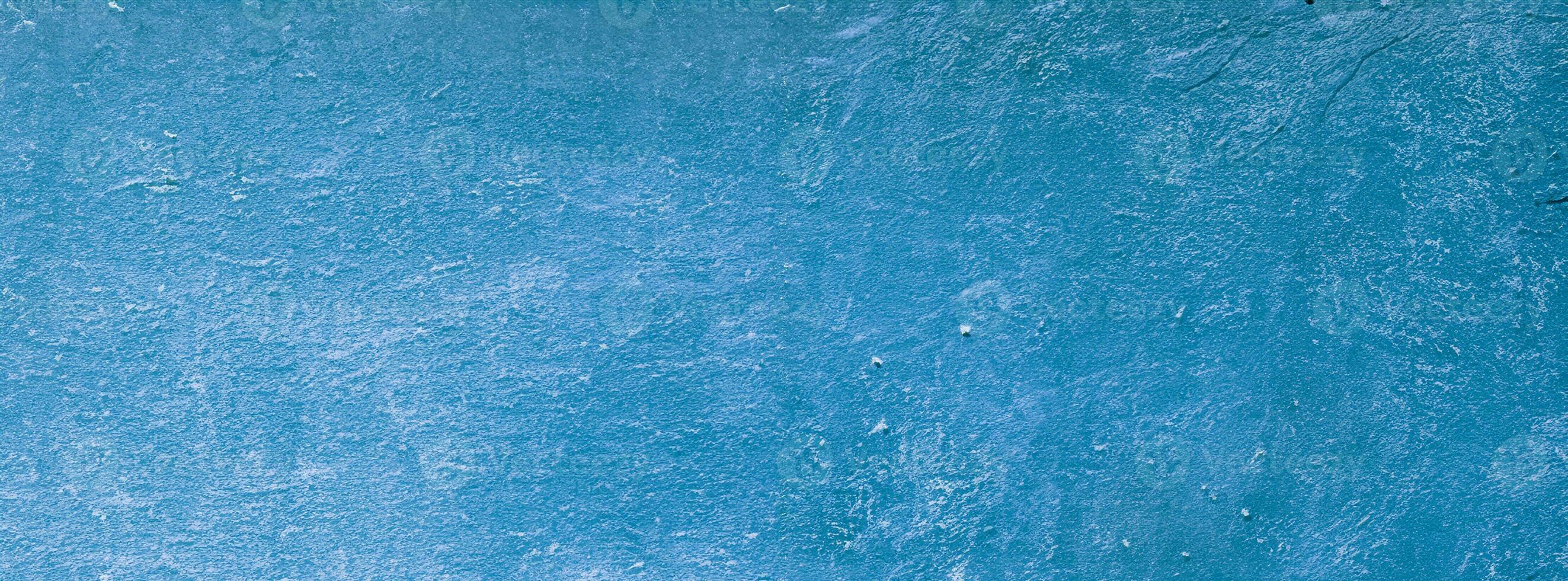 Modern turquoise limestone texture in blue light seam home wall paper concept for flat Christmas wide background, Back concrete table top floor, wall paper granite pattern, grunge seamless surface photo