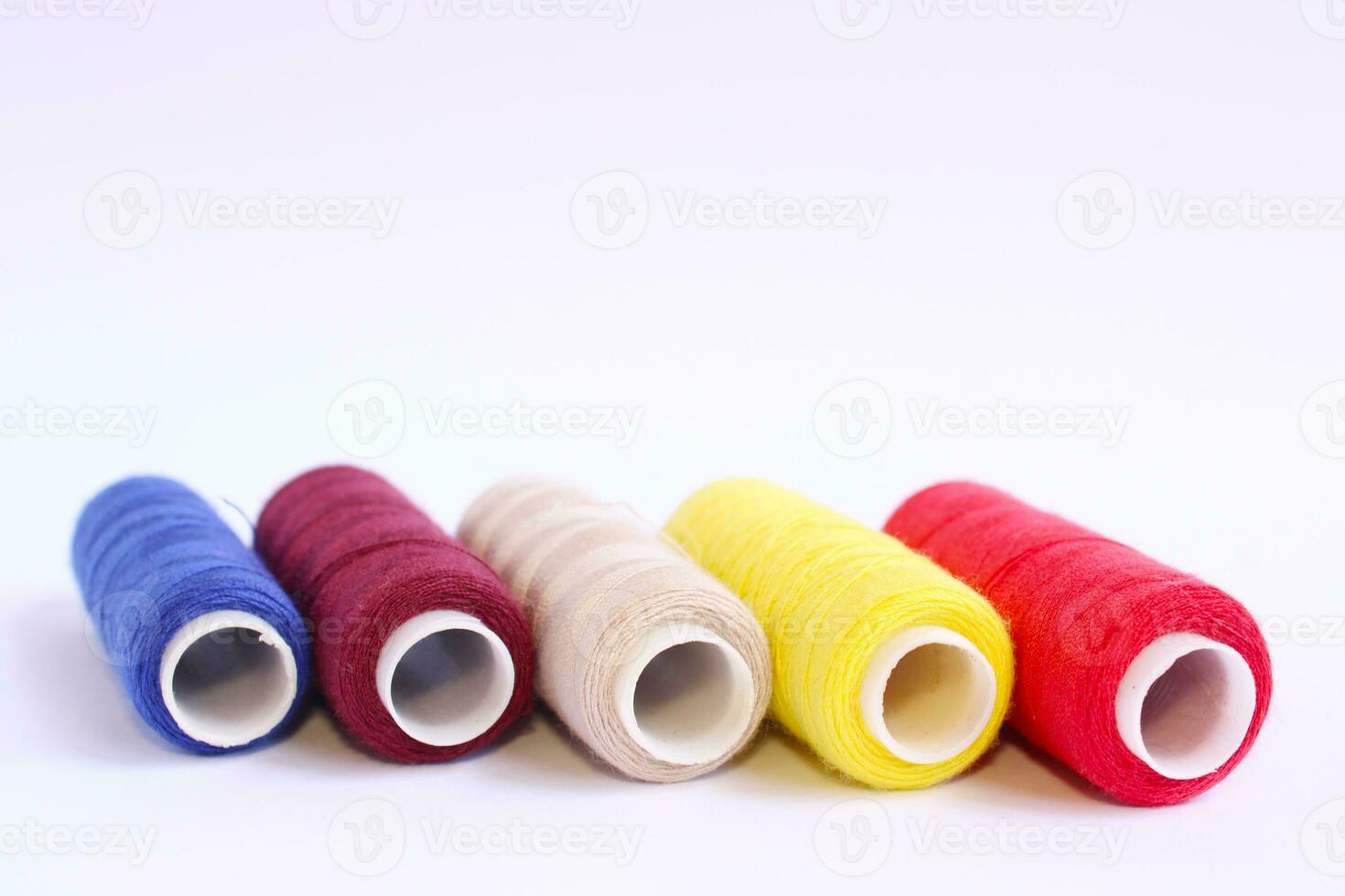 Spools of Sewing Thread on White Background photo