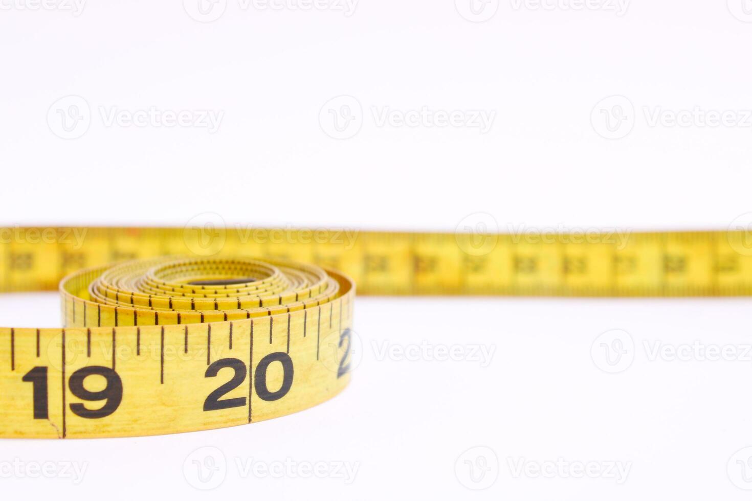 Yellow Tape Measure against White Background photo