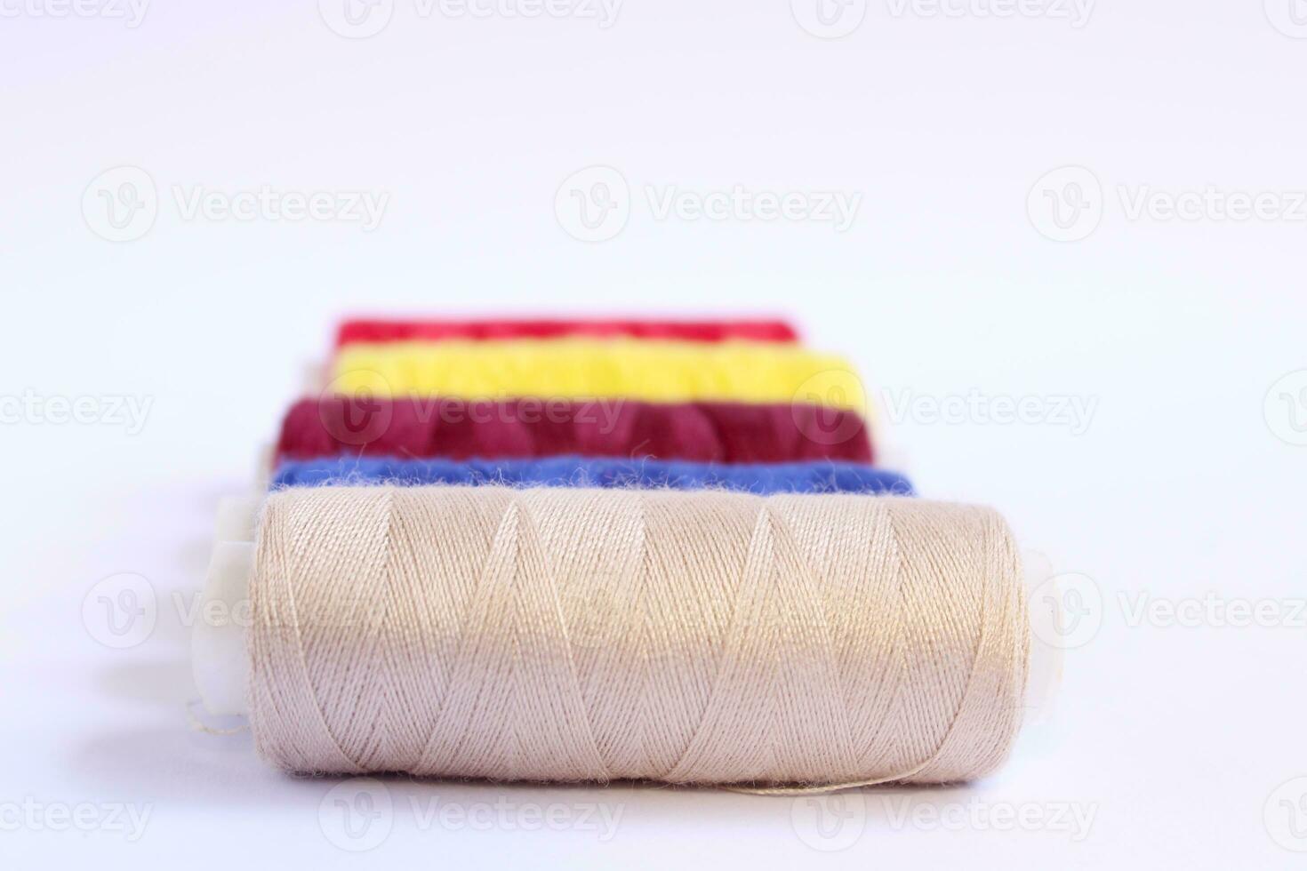 Spools of Sewing Thread against White Background photo