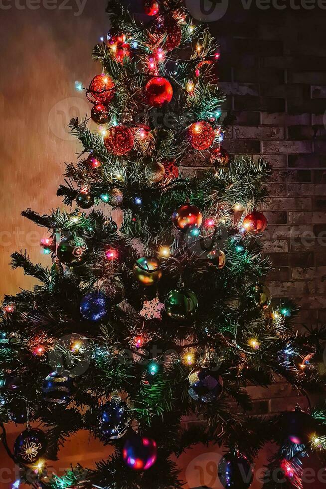 Christmas tree with multi-colored shining garland. photo