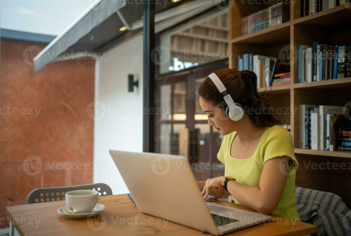 Young woman having video call via computer in the home office.Business video conferencing. photo