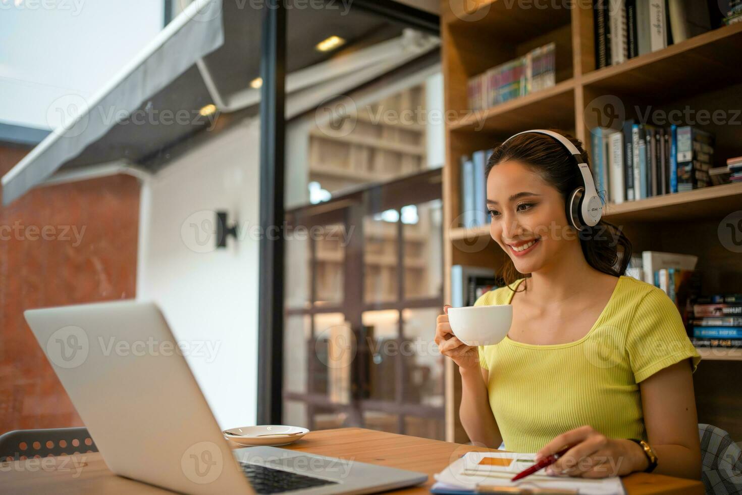 Young woman having video call via computer in the home office.Business video conferencing. photo