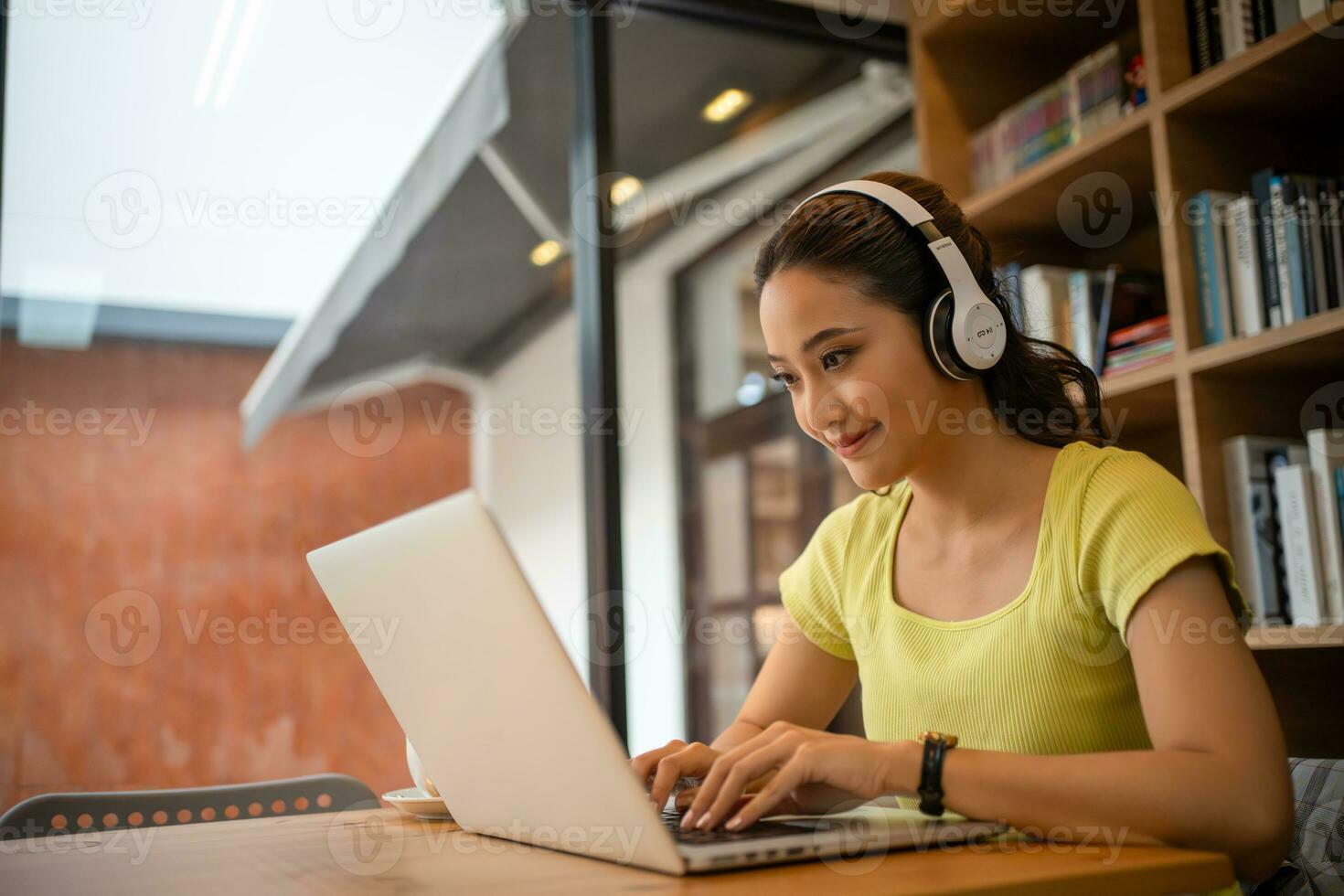 Young woman having video call via computer in the home office.Business video conferencing. photo