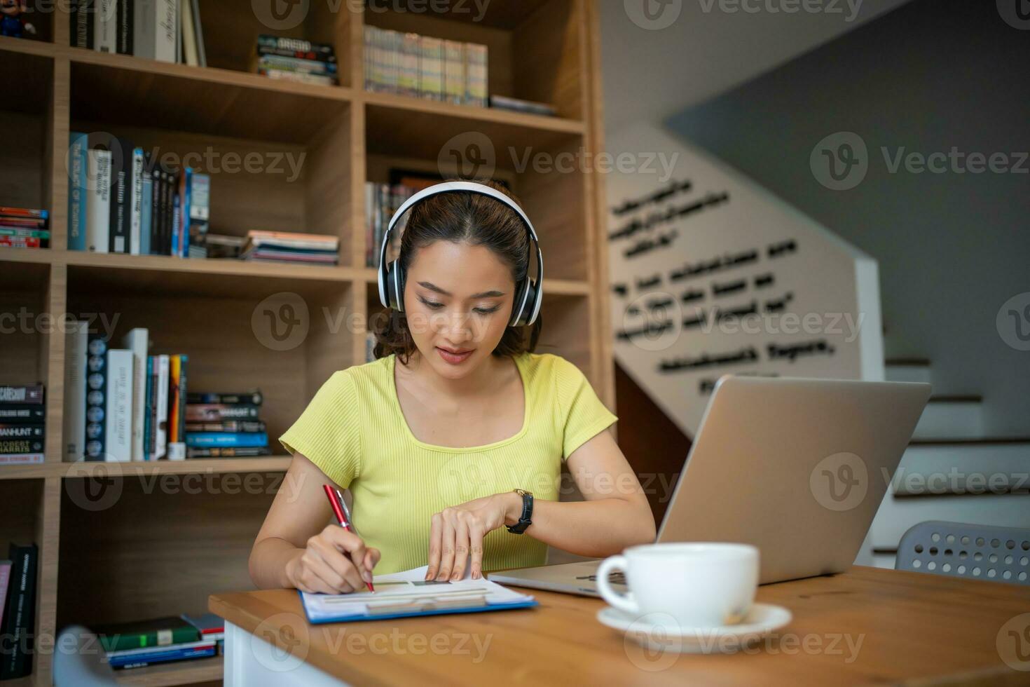 Young woman having video call via computer in the home office.Business video conferencing. photo