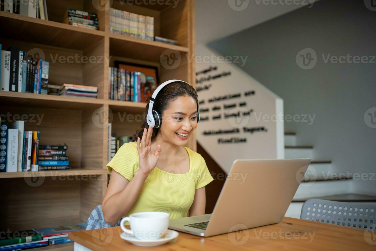 Young woman having video call via computer in the home office.Business video conferencing. photo