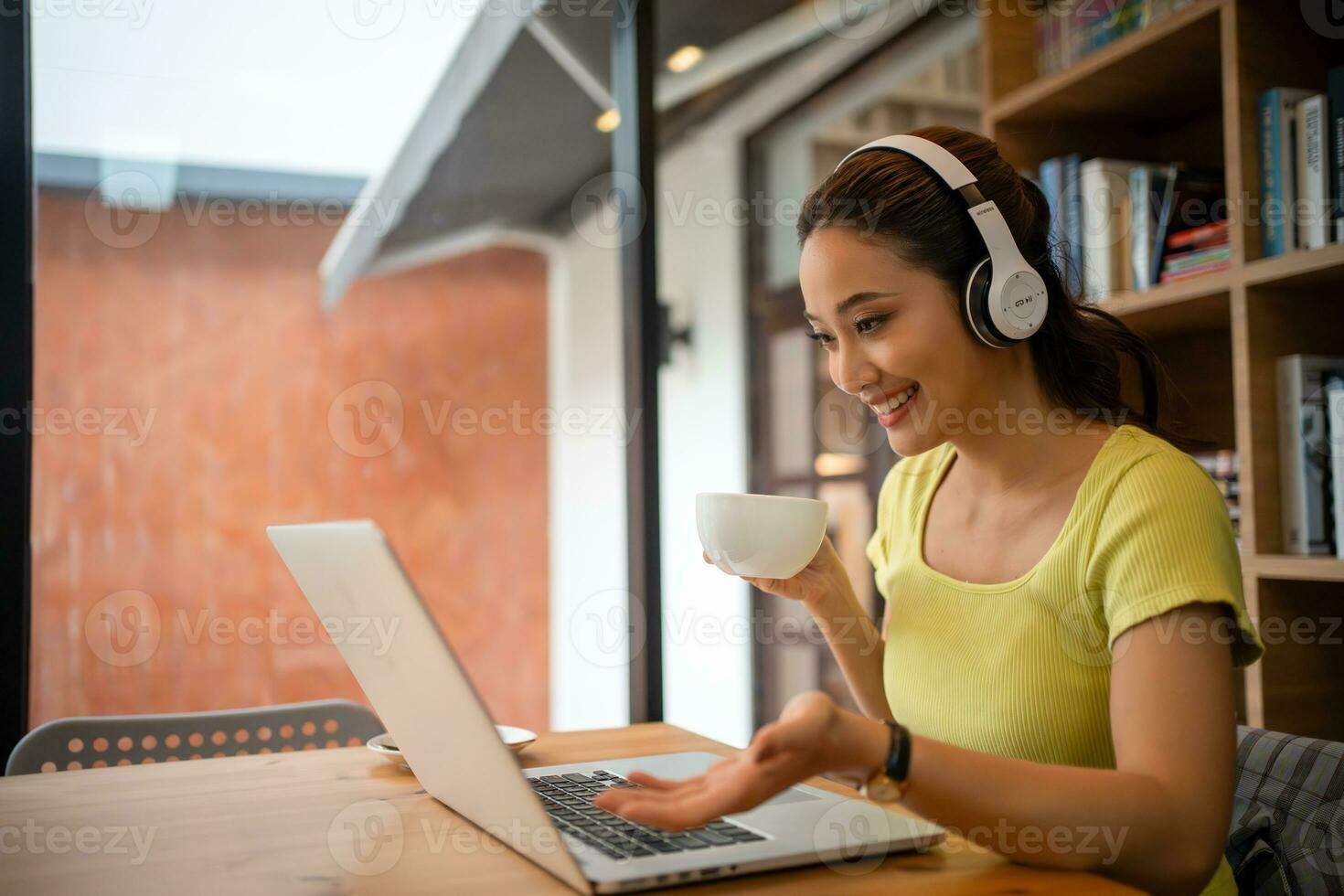 Young woman having video call via computer in the home office.Business video conferencing. photo