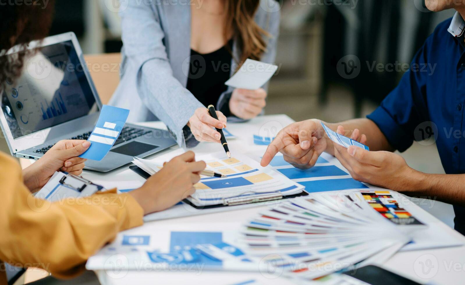 Team business people meeting in office. Employee brainstorm and work plan and discuss project by point on paper and tablet. photo