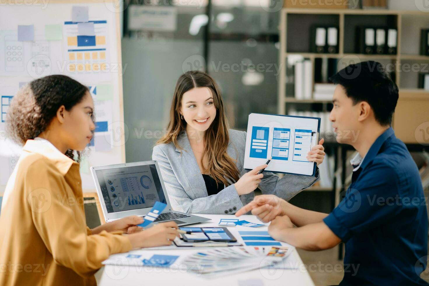Team business people meeting in office. Employee brainstorm and work plan and discuss project by point on paper and tablet. photo