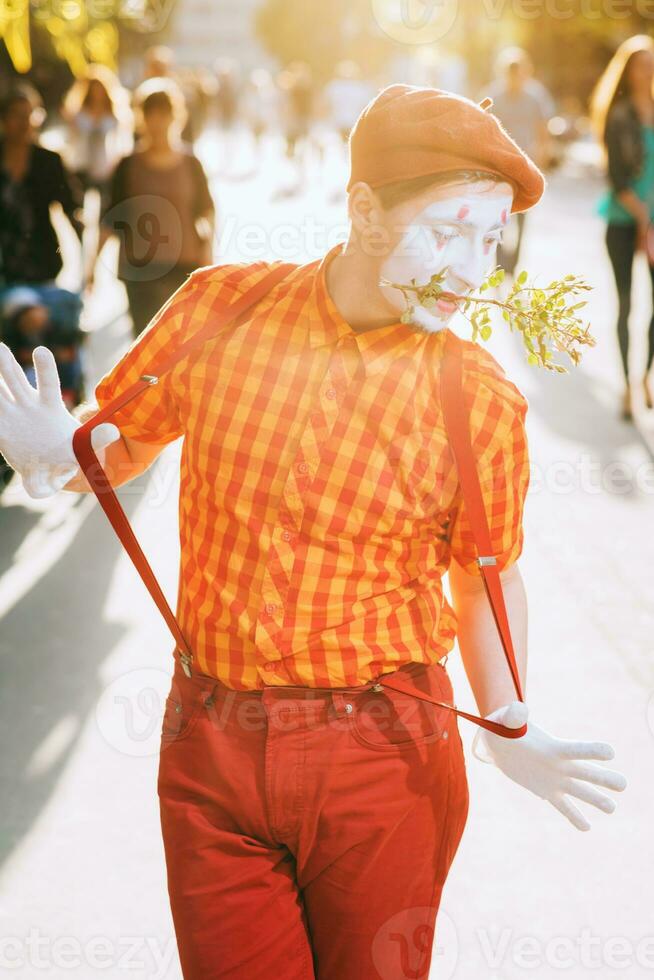 Mime on the street waiting to meet with his lover photo