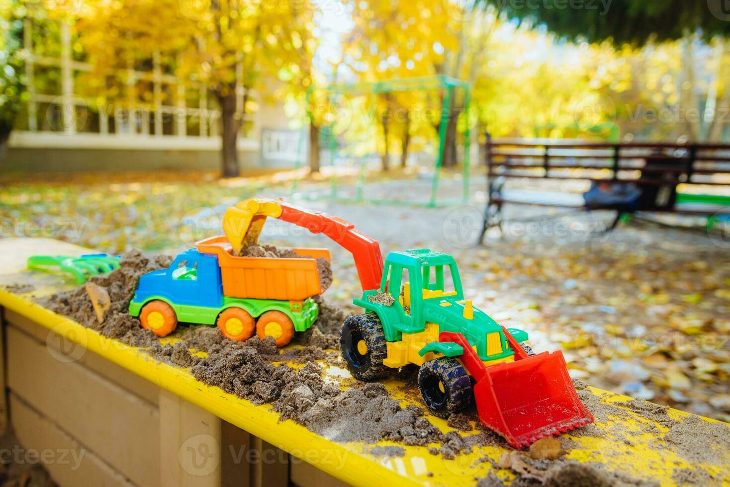 children's toys in the sandbox close-up photo