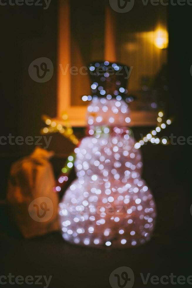 Christmas snowman that stands at the window photo