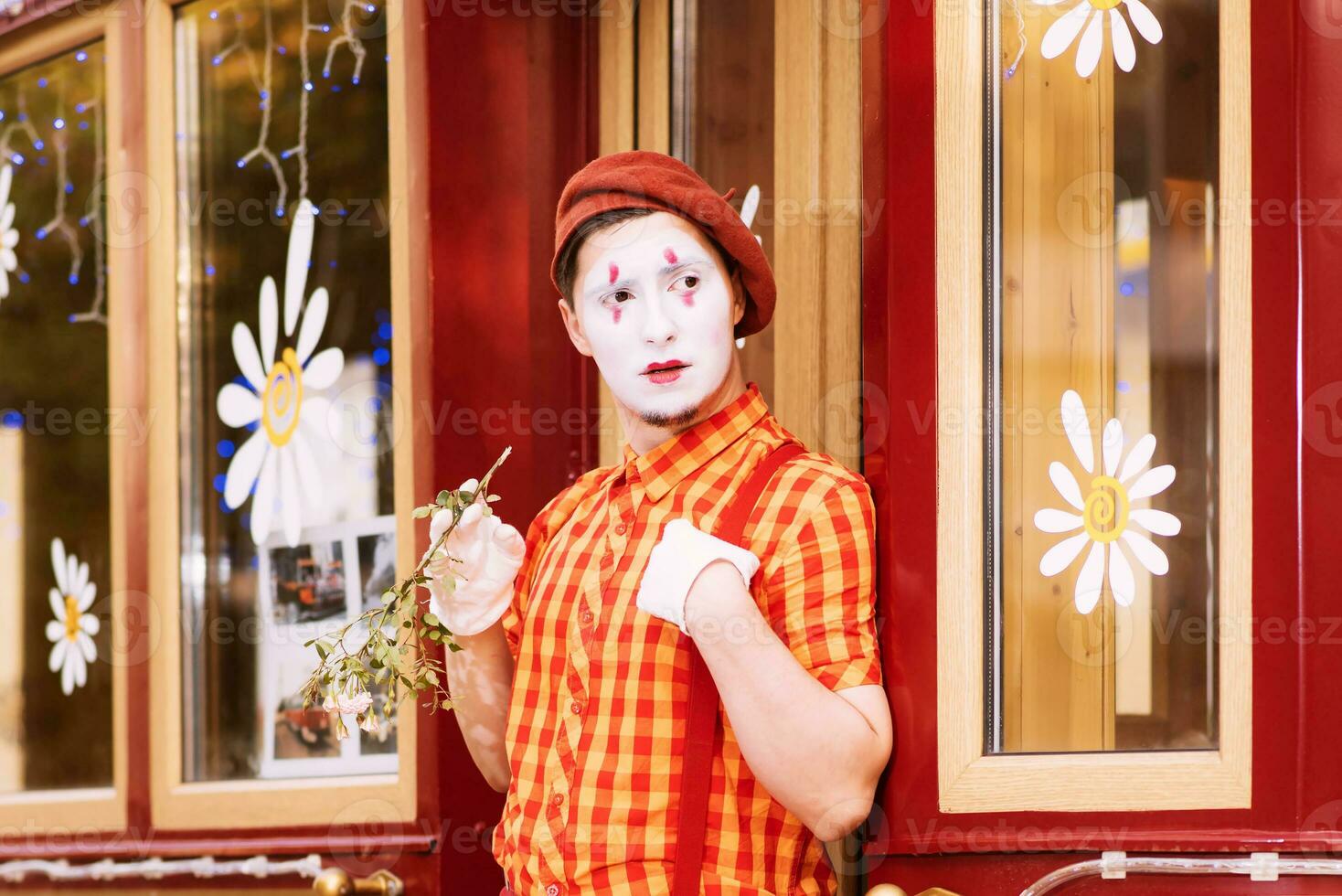 Mime on the street waiting to meet with his lover photo