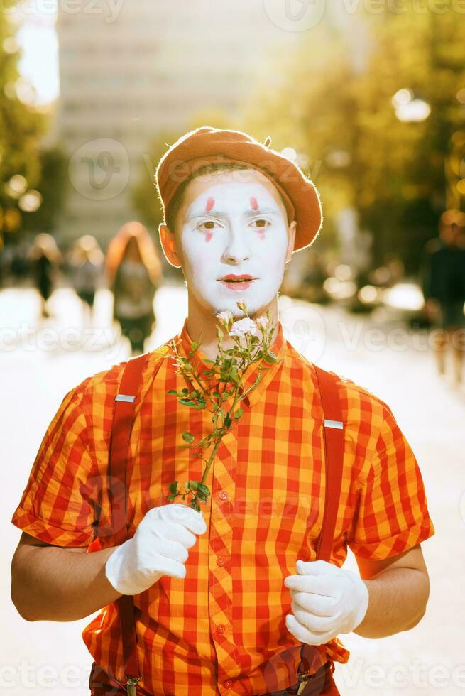 Mime on the street waiting to meet with his lover photo