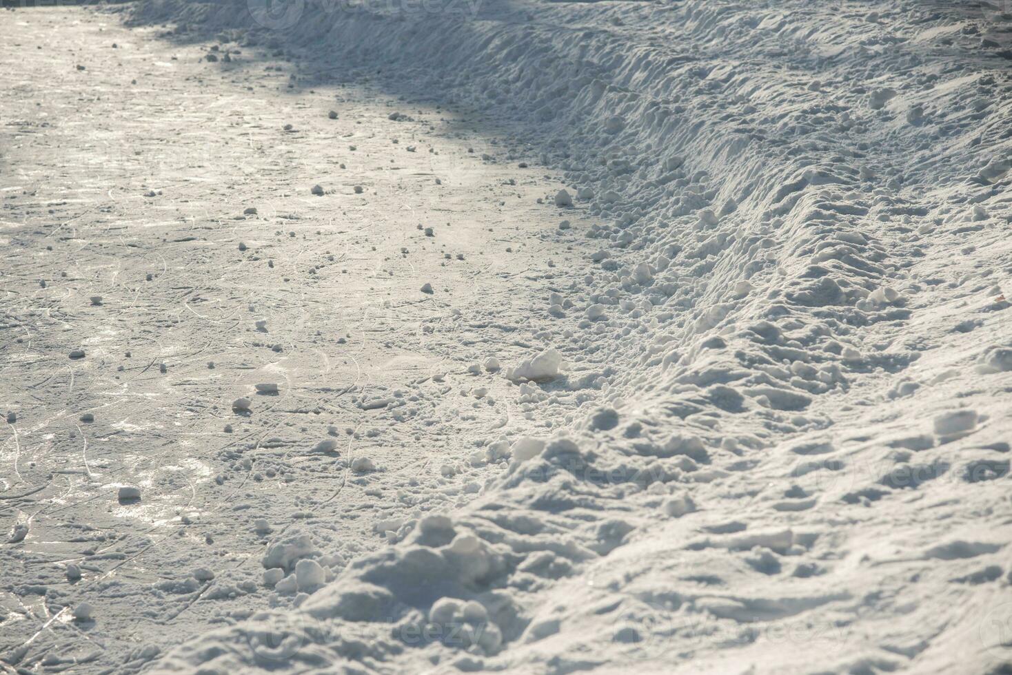 traces on the ice from skates on the rink photo