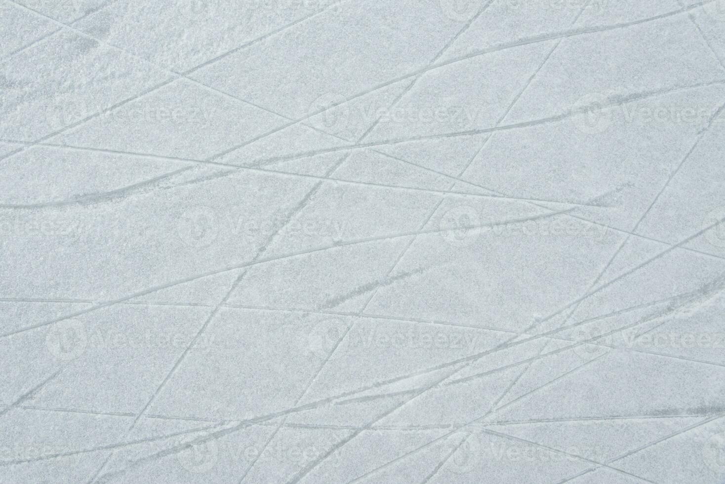 traces on the ice from skates on the rink photo