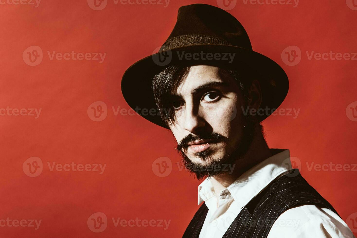 portrait of a guy who is posing in the studio photo