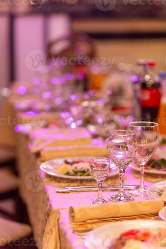 Served festive table with snacks, glasses, glasses, cutlery and napkins for a banquet photo