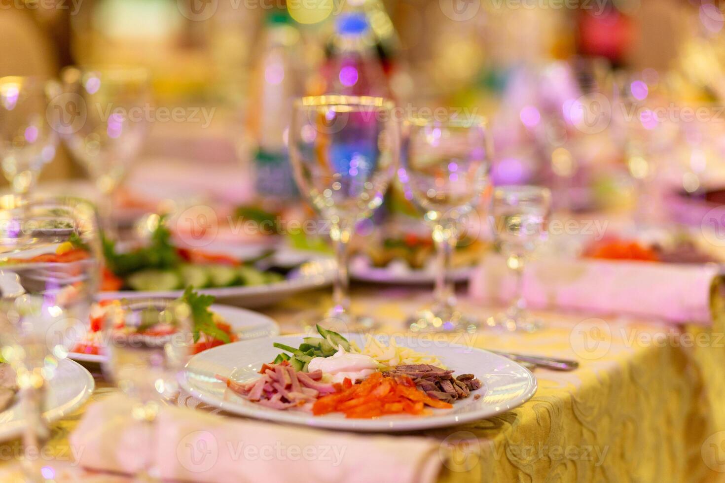 Served festive table with snacks, glasses, glasses, cutlery and napkins for a banquet photo