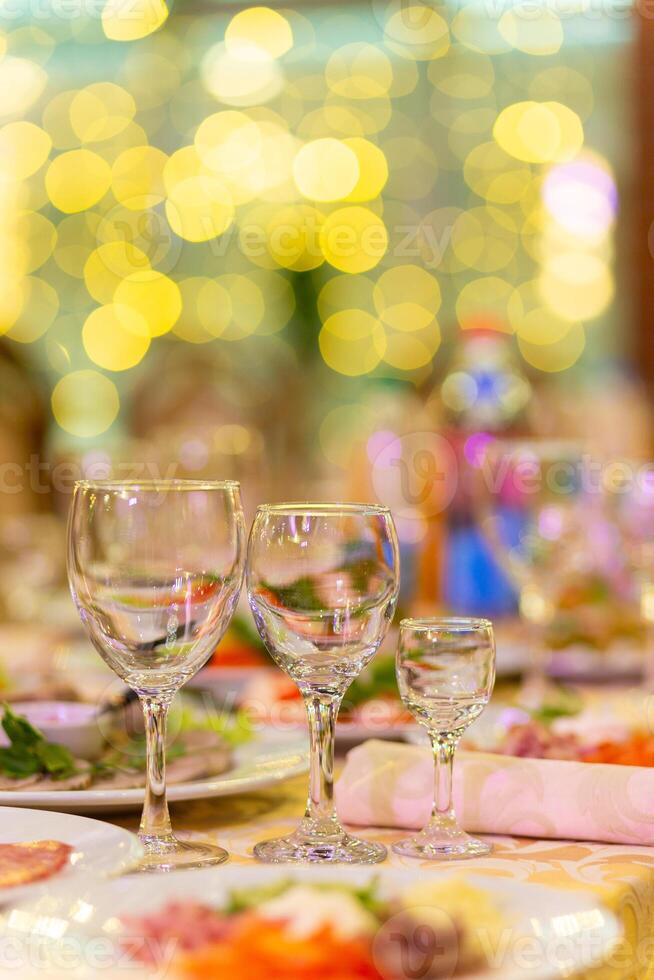 Served festive table with snacks, glasses, glasses, cutlery and napkins for a banquet photo