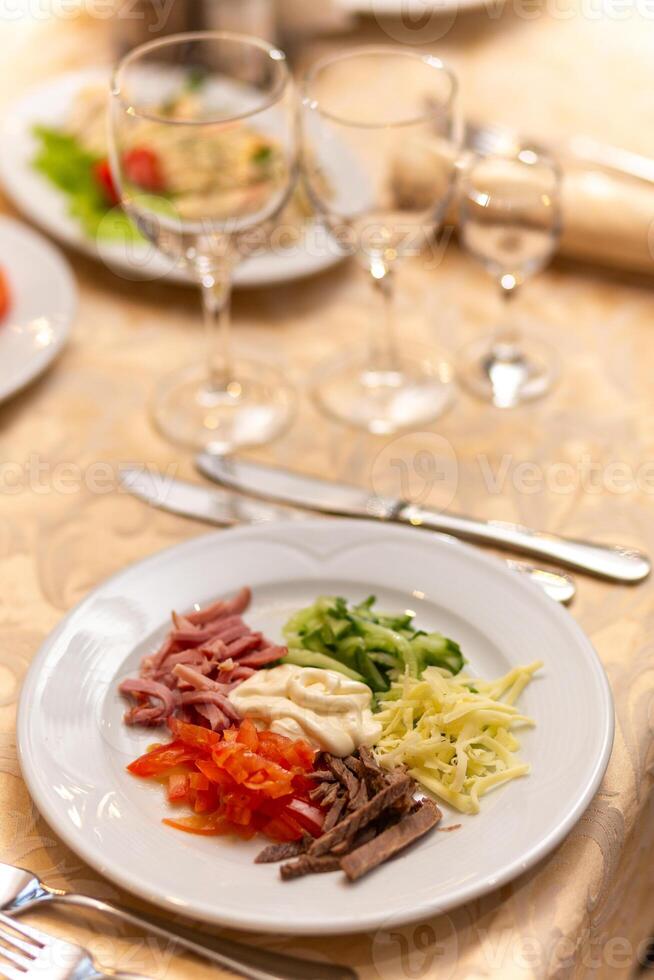 Served festive table with snacks, glasses, glasses, cutlery and napkins for a banquet photo