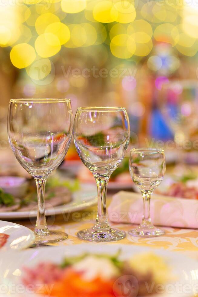 Served festive table with snacks, glasses, glasses, cutlery and napkins for a banquet photo