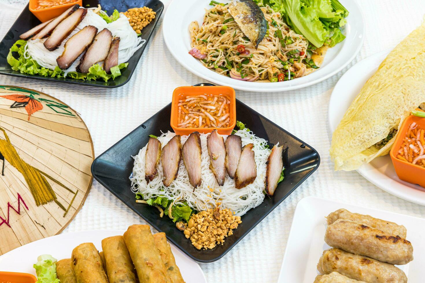 Bun thit nuong - Vietnamese grilled pork and noodles It is a mix of vermicelli noodles, grilled pork, eaten along with vegetable and sour and sweet fish sauce. - Vietnamese food photo