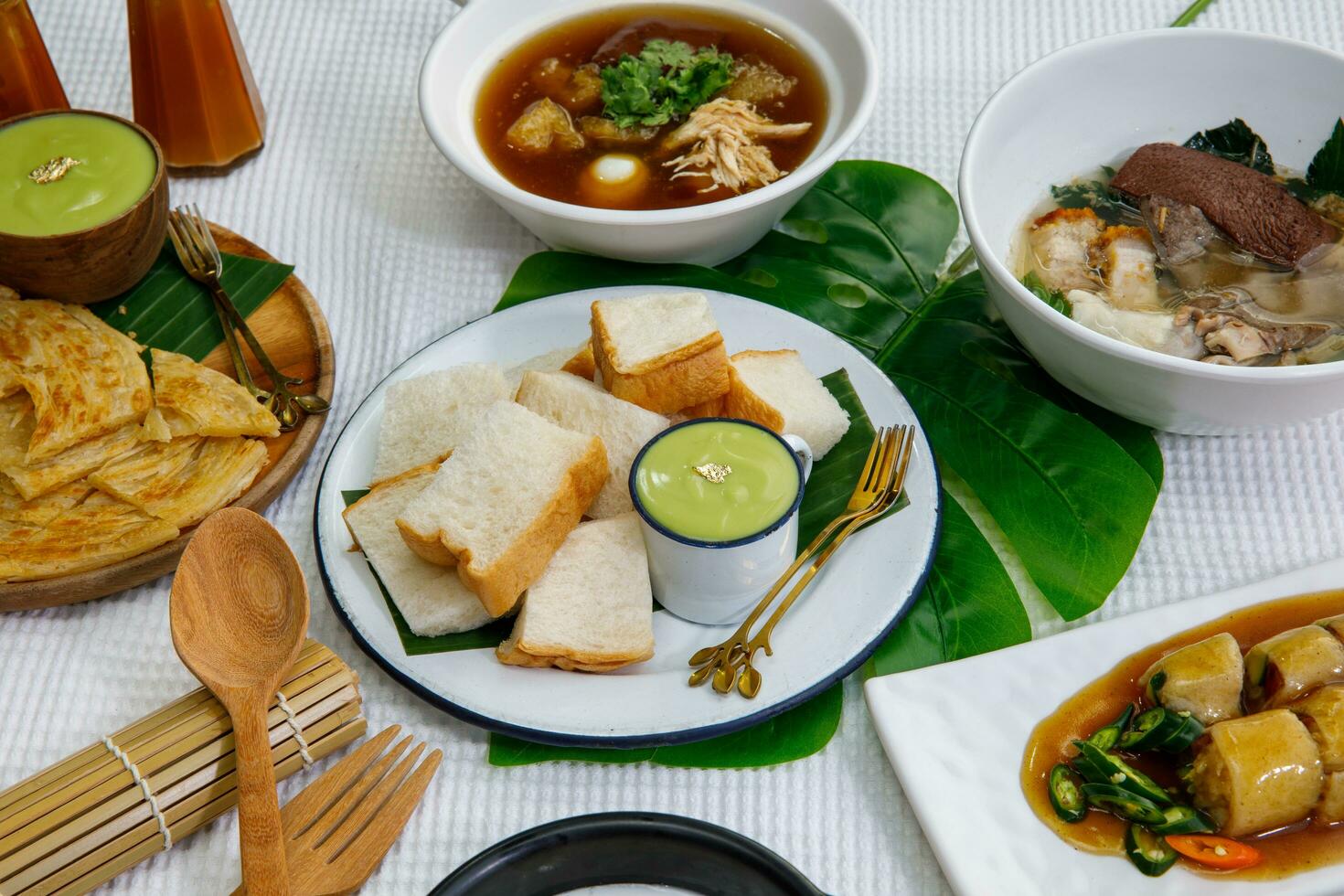 lice steamed bread and pandan custard, Green custard cream with bread.Thai dessert photo