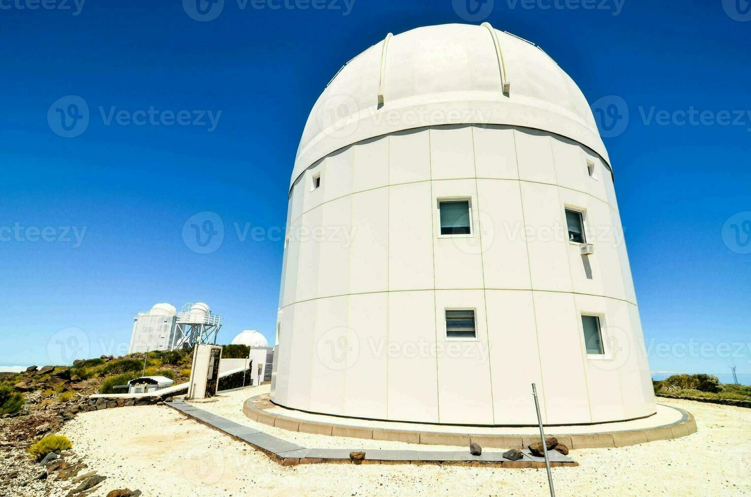 the large white telescope sits on top of a hill photo