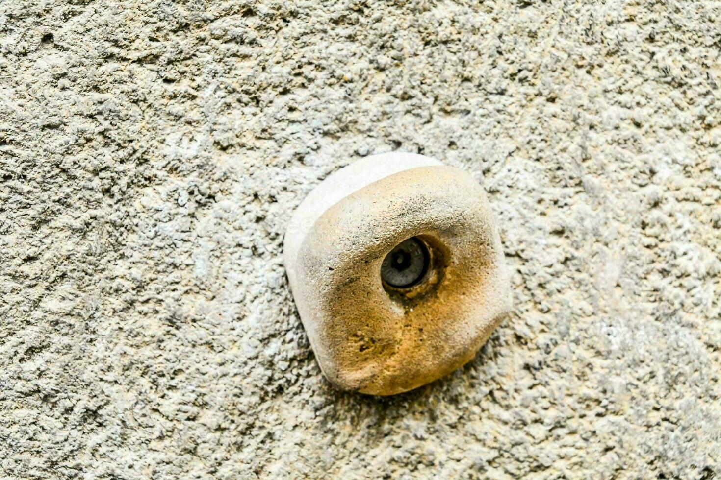 a stone wall with a hole in it photo