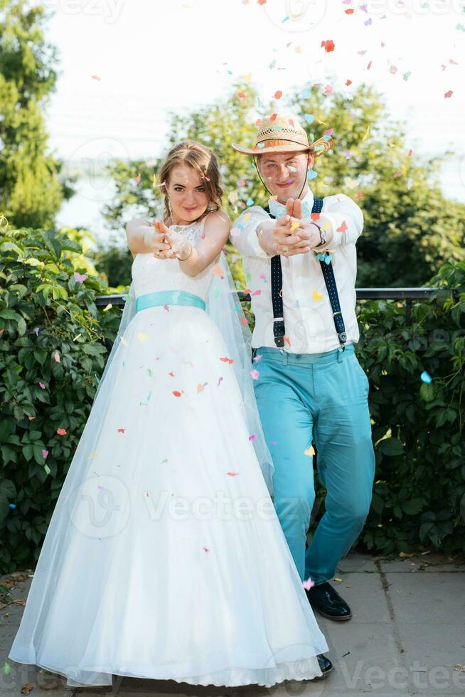 the bride and groom pose for the camera photo