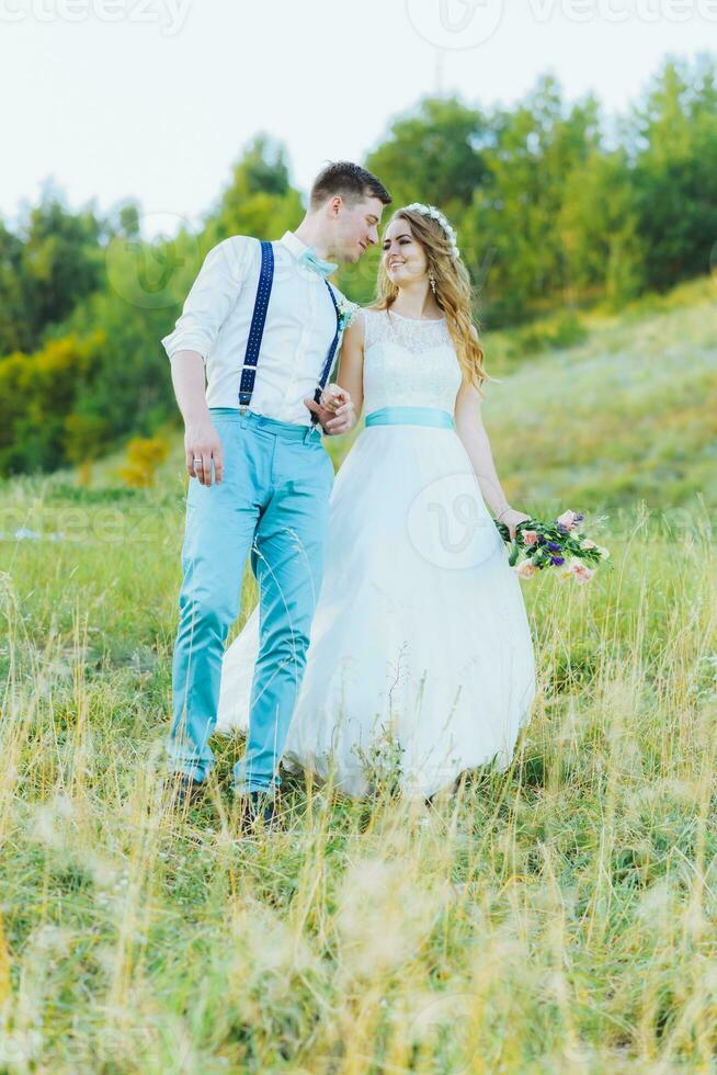 the bride and groom are photographed on the nature photo