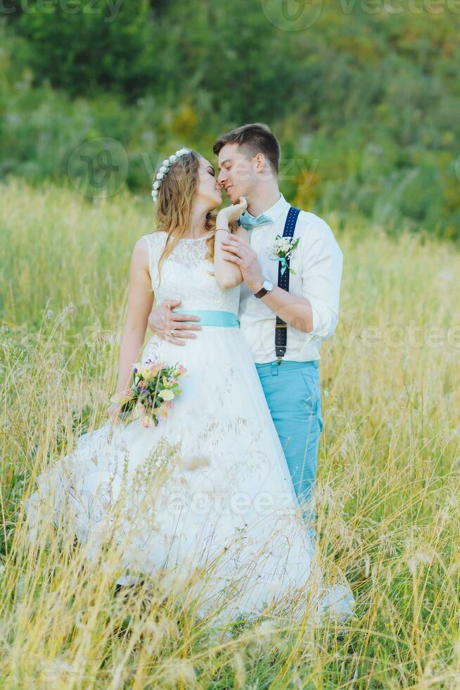 the bride and groom are photographed on the nature photo