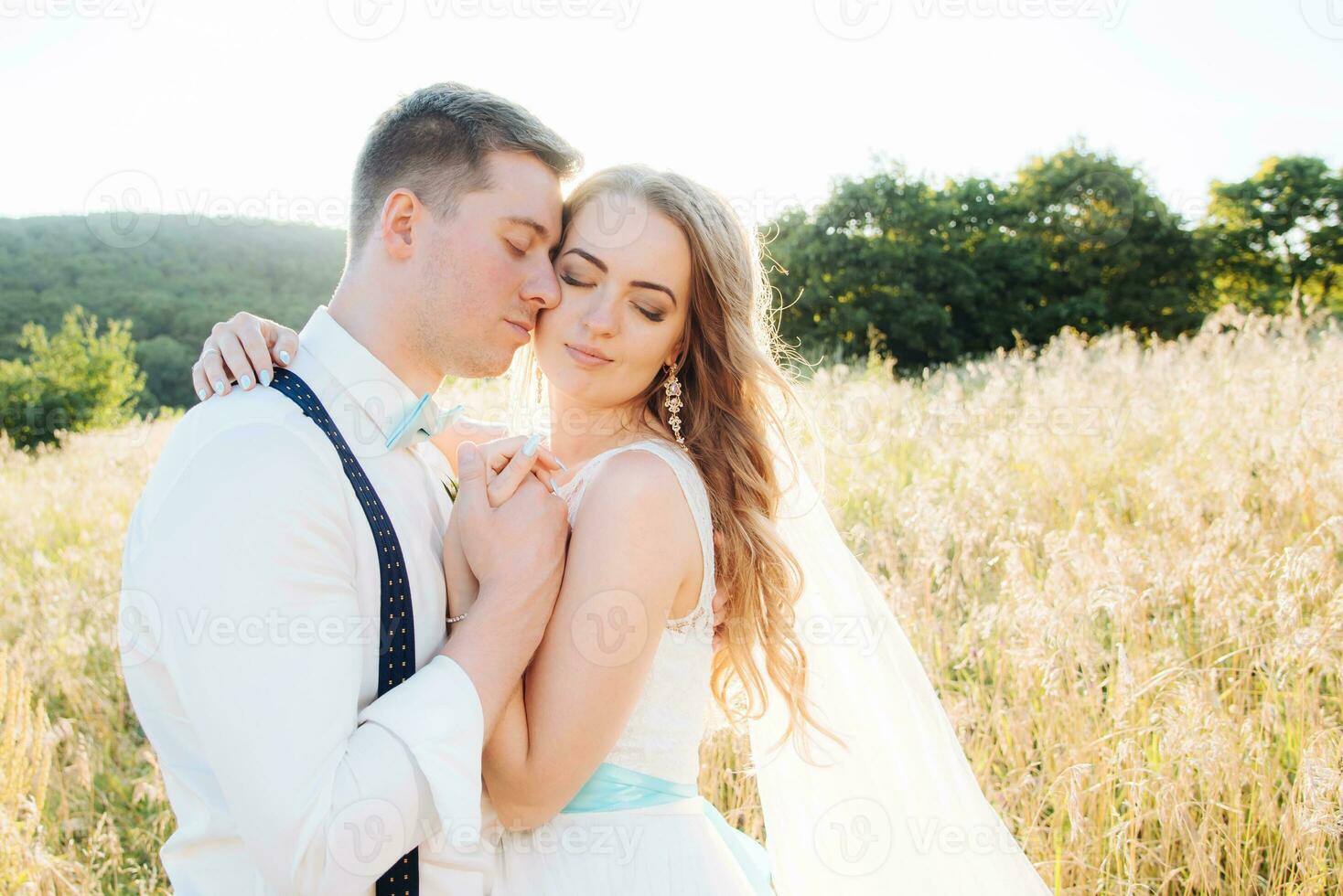 the bride and groom are photographed on the nature photo