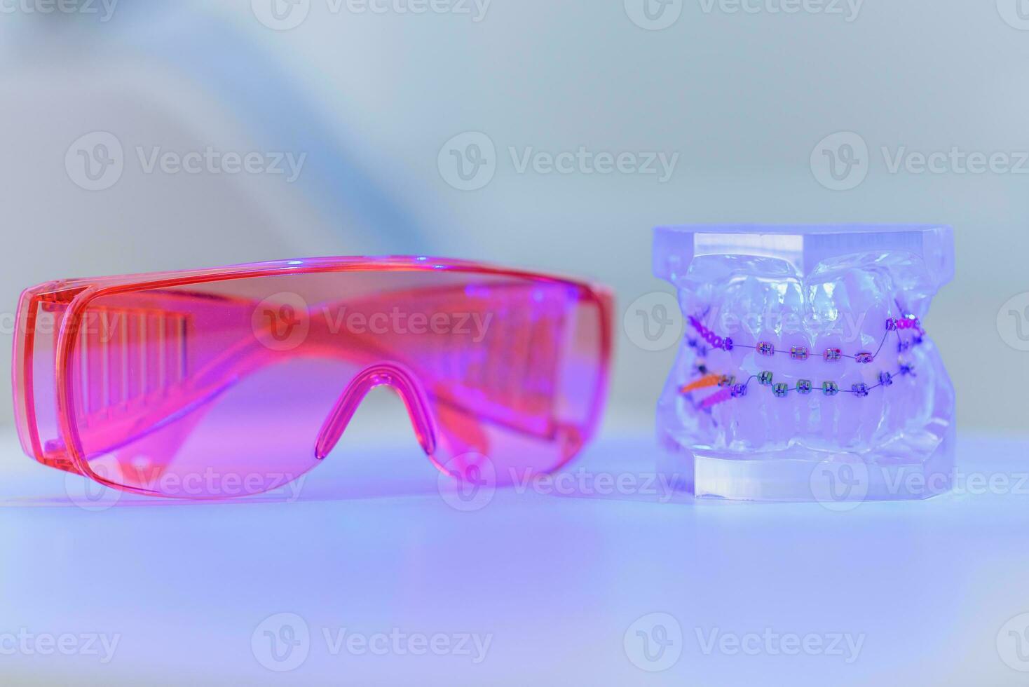 artificial jaws with braces lie with glasses photo