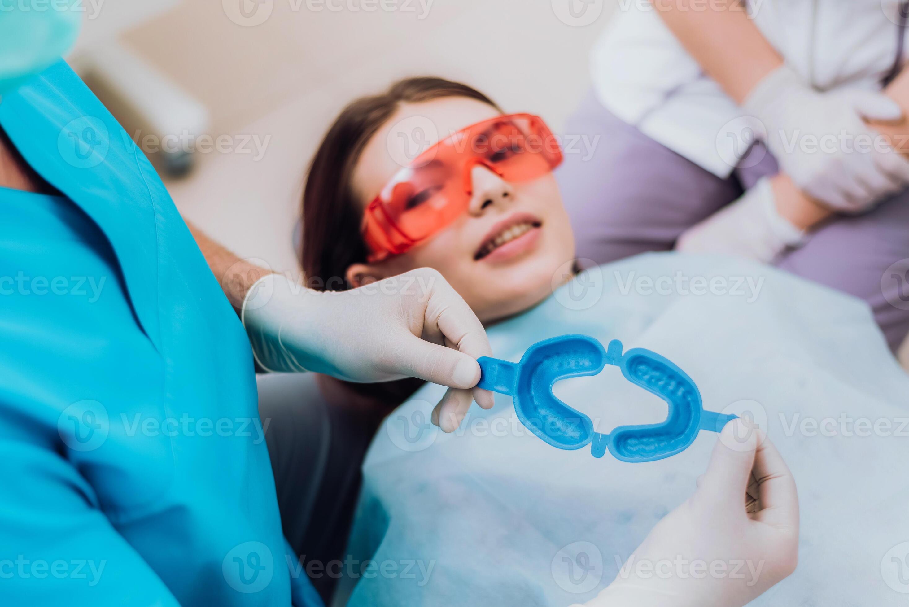doctor orthodontist performs a procedure for cleaning teeth 35066864