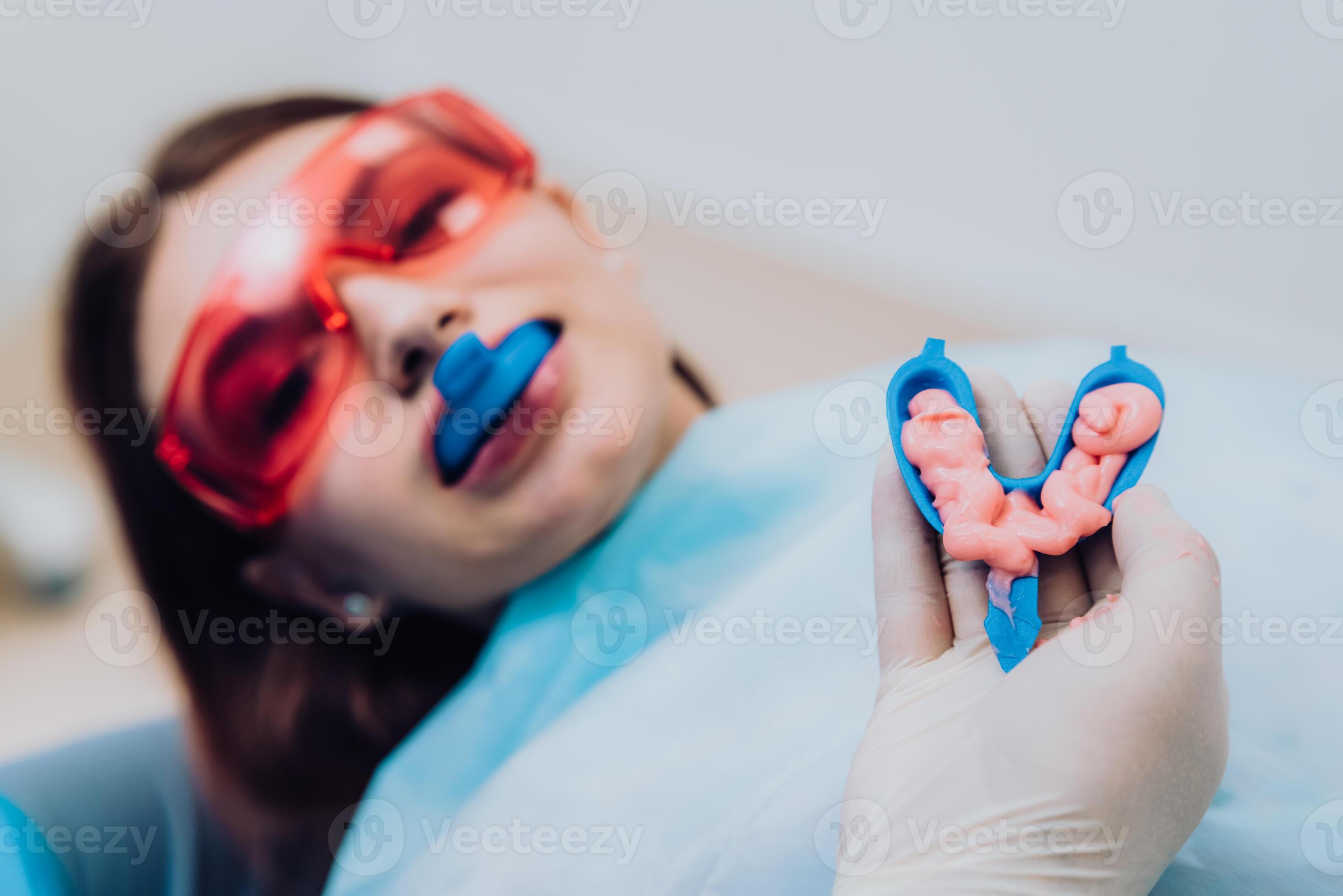 doctor orthodontist performs a procedure for cleaning teeth 35066908