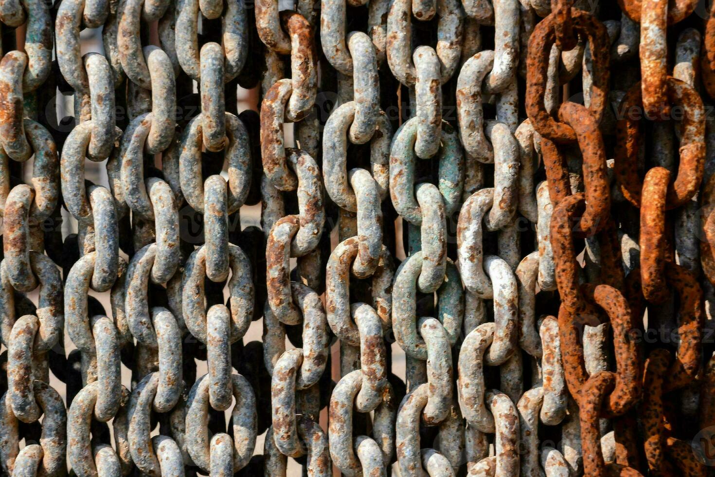 a close up of a chain of rusty metal links photo