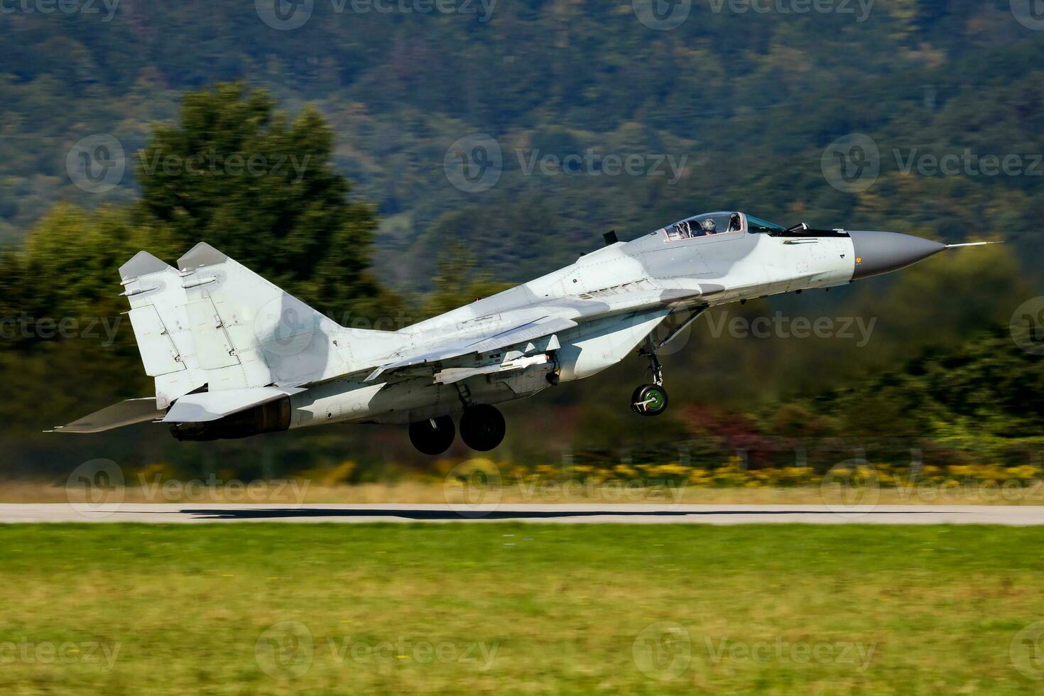 Military fighter jet plane at air base. Airport and airfield. Air force flight operation. Aviation and aircraft. Air defense. Military industry. Fly and flying. photo