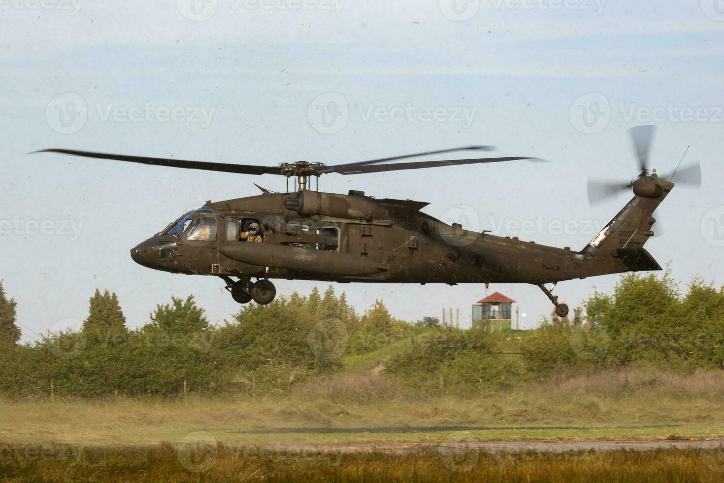 Untitled military helicopter at air base. Air force and army flight transportation. Aviation and rotorcraft. Transport and airlift. Military industry. photo